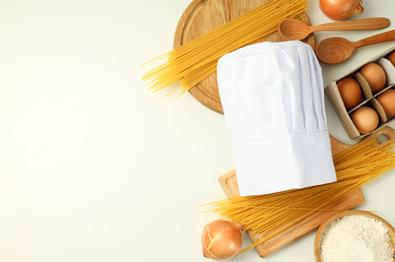 Concept of cooking food with chef hat, space for text, a Food & Drink Photo by AtlasStudio PRO