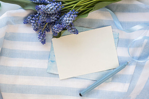 Mockup with blue flowers featuring invitation, card, and wedding
