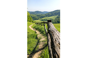 Serene mountain path with rustic, a Nature Photo by Lermont51