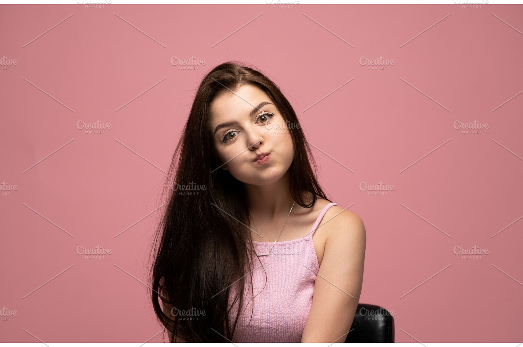 Young woman making a playful fish, a Person Photo by volodymyrshtun13795