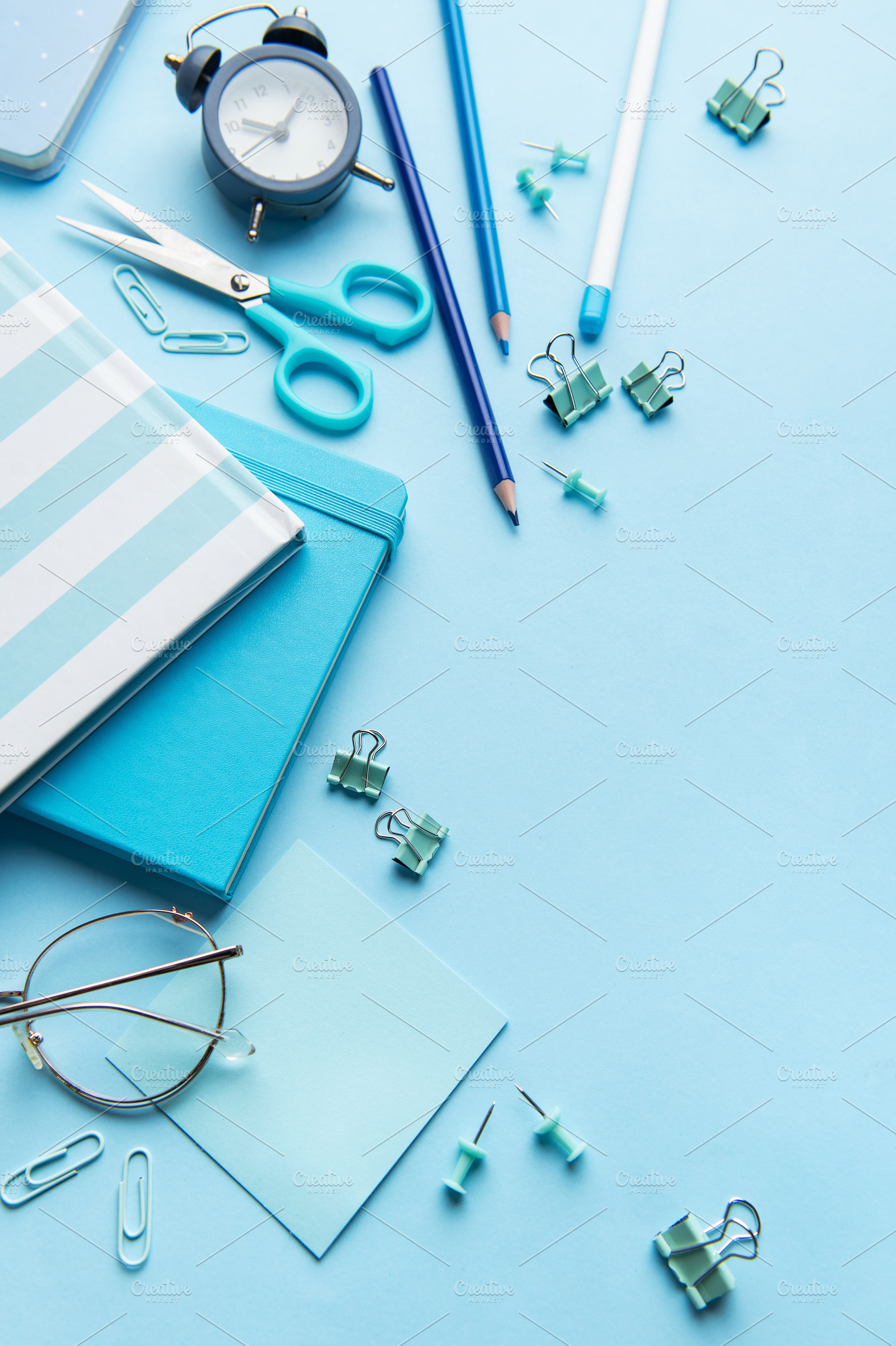 Blue stationery, notebooks, and office supplies organized on a d, a School & Education Photo by Olena Rudo