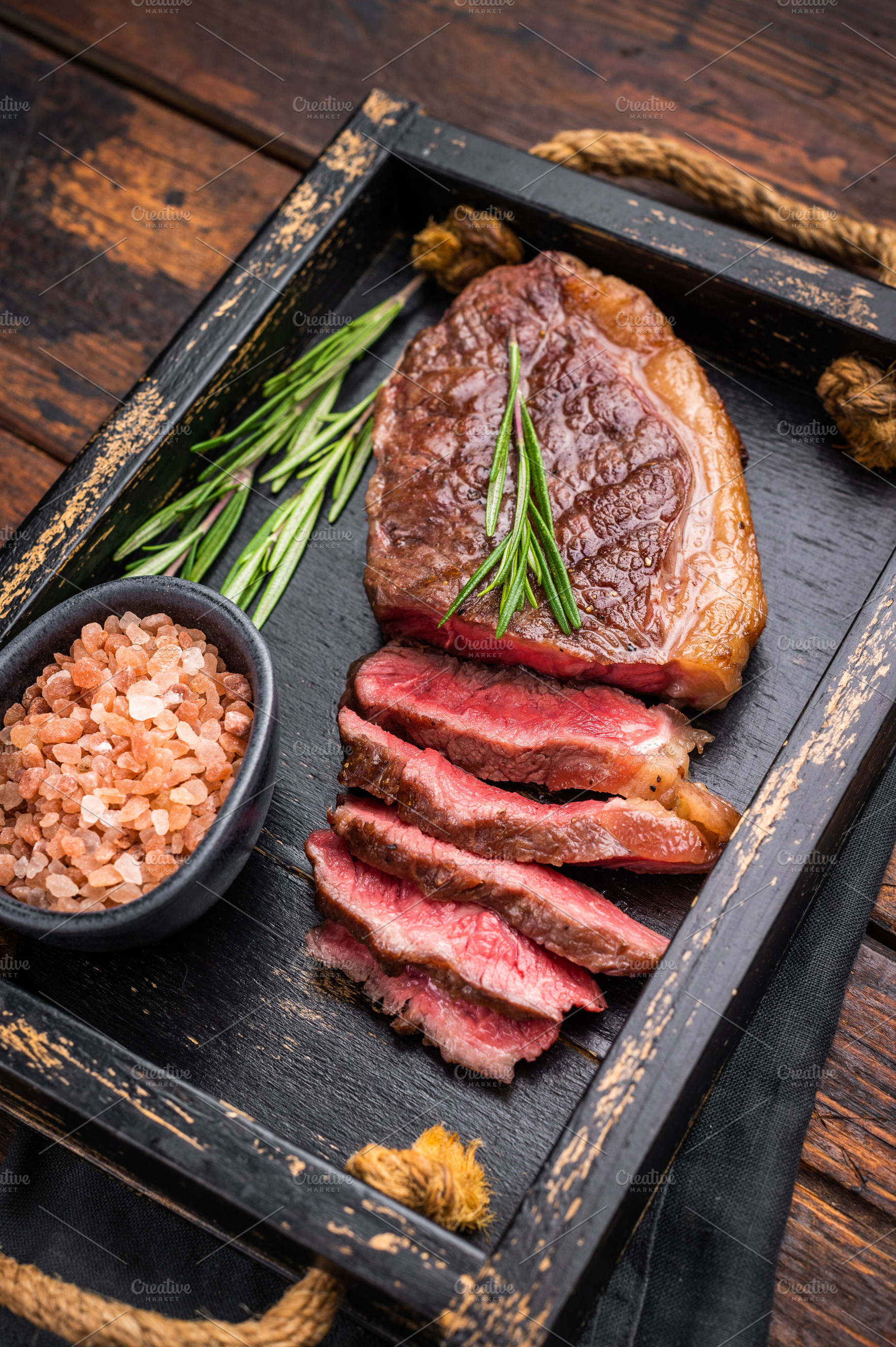 Deliciously charred grilled New York strip or striploin steak wi, a Food & Drink Photo by composter-box@mail.ru