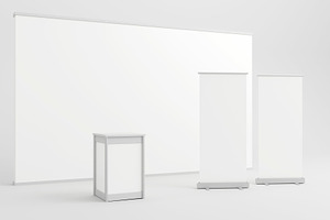 White backdrop with display counter and two blank roll-up banners., a Background Photo by RF Images