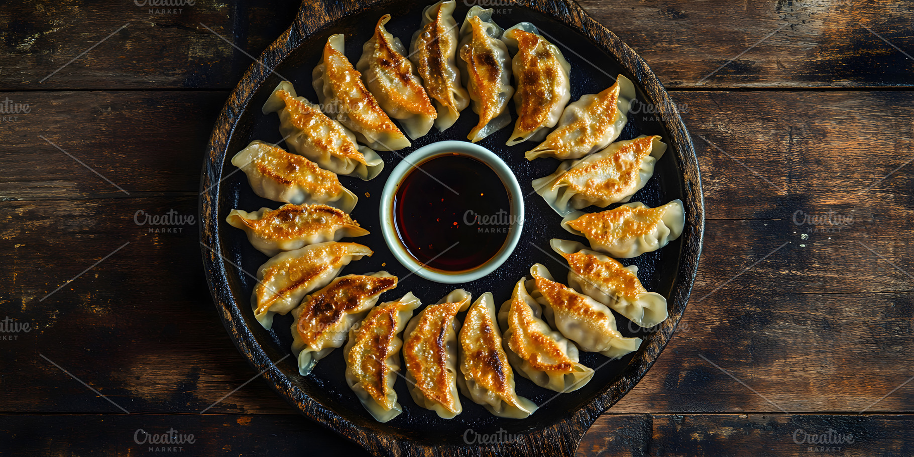 Pan-fried dumplings with soy dipping, a Food & Drink Photo by Photostock