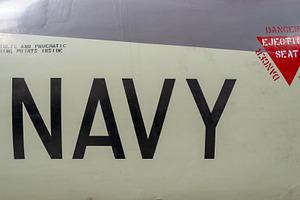 Vintage aircraft fuselage with navy markings and ejection seat w, a Transportation Photo by GoodGoods
