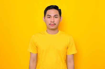 Handsome Asian man looking at camera, a Person Photo by Sewupari Studio
