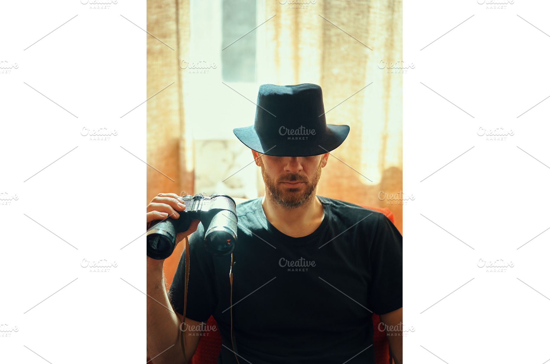 Mysterious man in black hat holding, a Person Photo by Gladkov photography