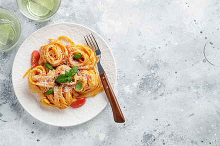 Tasty appetizing classic italian tagliatelle pasta with tomato sauce, cheese pa, a Food & Drink Photo by Budarinphoto