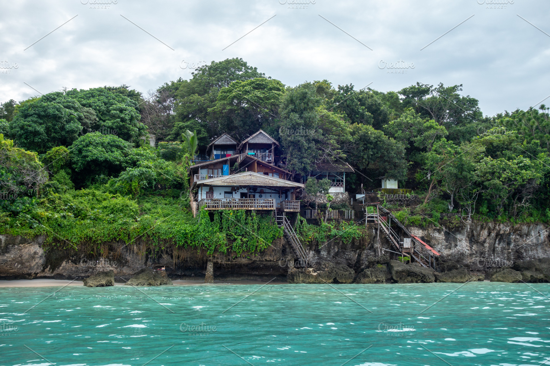 Traditional cliffside houses on Bira Beach, Sulawesi, Indonesia, a Nature Photo by GoodGoods