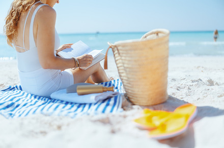 Closeup on stylish woman on ocean coast with straw bag, a Person Photo by Alliance Images