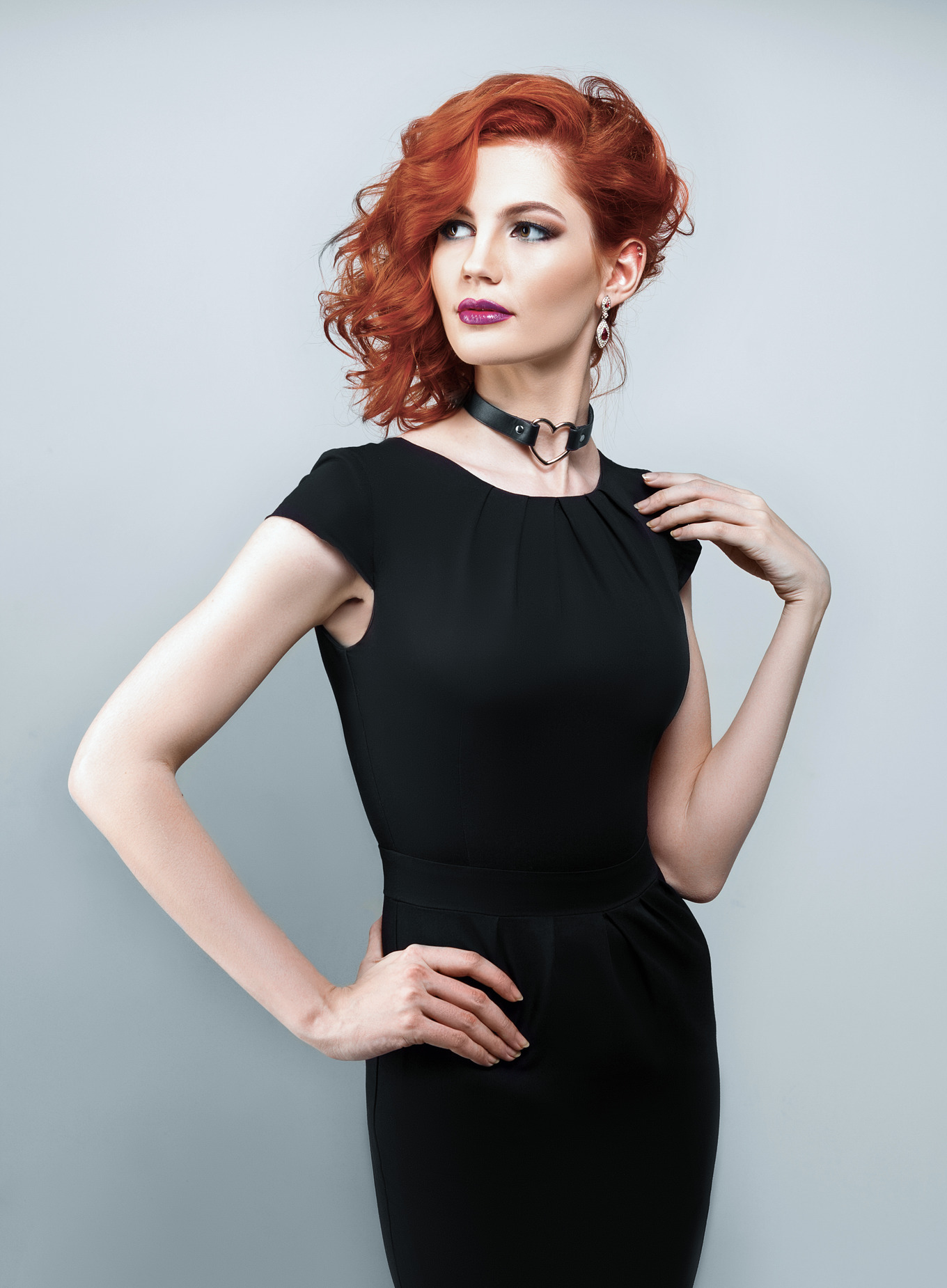 Beautiful woman with red hair in a black dress featuring fashion, model ...