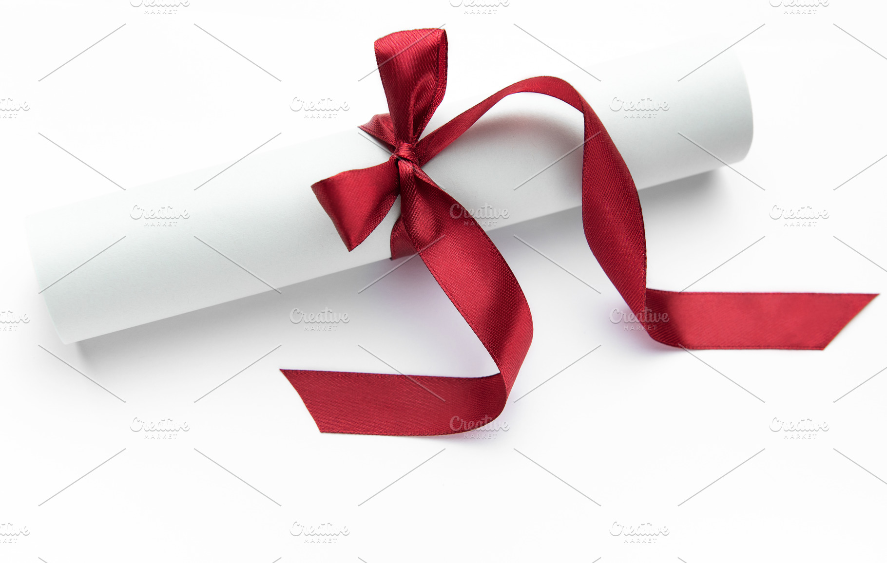 Diploma scroll with red ribbon symbolizing achievement and succe, a Holiday Photo by Olena Rudo