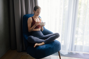 Woman sitting cross legged in an