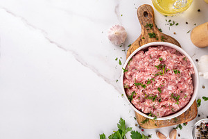 Ground beef, minced meat ready for cooking dinner, a Food & Drink Photo by Rimma
