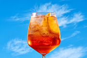 Glass of aperol spritz cocktail, a Photo by zeStudioPhoto (Thumbnail 1 of 2)