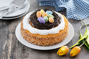 Homemade Easter egg cake on wooden table, a Food & Drink Photo by etorres69