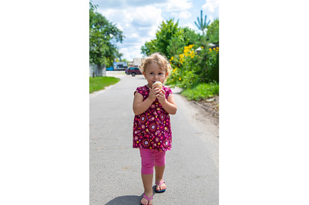 The child eats ice cream on the, a Person Photo by yanadjana