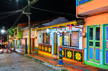 Traditional colorful houses in the old town of Guatape in Colombia, an Architecture Photo by Leonid Andronov