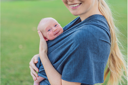 Mom walks with her newborn baby in a