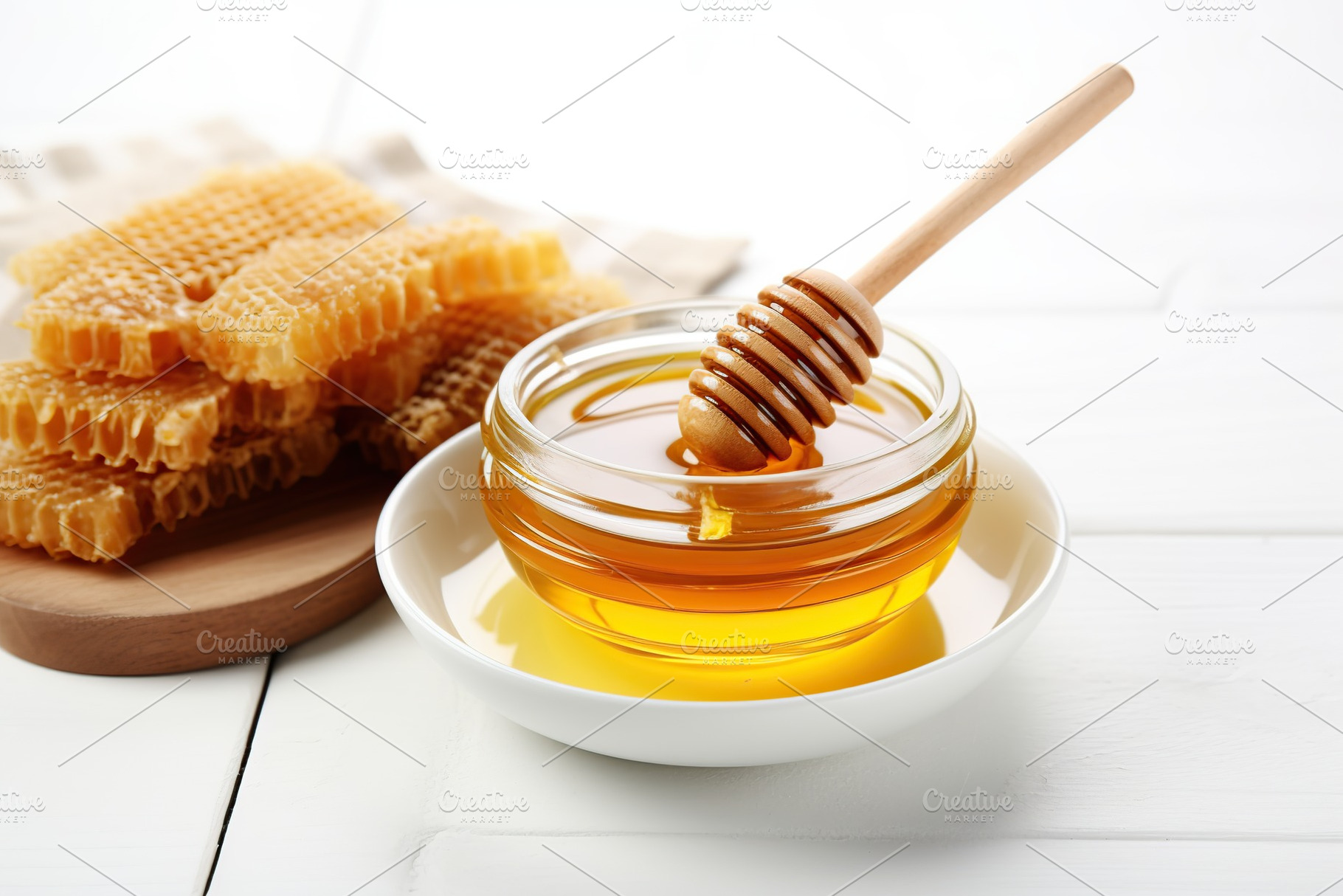 Honey in glass bowl and wooden dipper on white background, a Food & Drink Photo by AlyaAnd