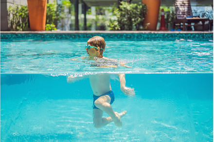 Boy having fun playing underwater in, a Person Photo by Elizaveta Galitskaya