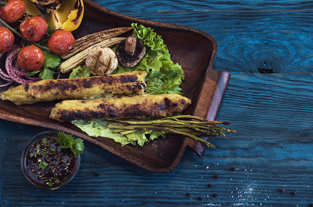 Grilled potato kebab featuring wooden, dish, and cherry, a Food & Drink Photo by Jan Jack Russo Media