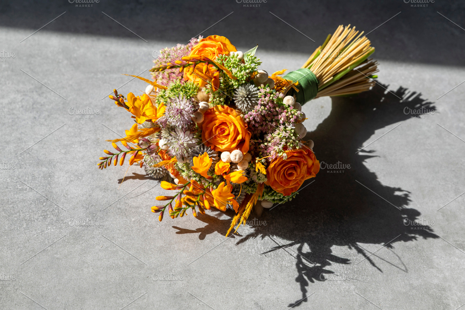 Top-down view of a flower bouquet made of orange roses and purpl, an Architecture Photo by Imaginarium