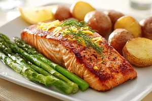 Delicious grilled salmon with asparagus and roasted potatoes on a dining table, a Food & Drink Photo by AlyaAnd
