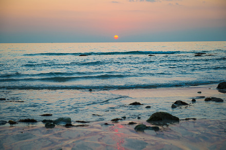 Sunset landscape with beach sun and containing sunset, beach, and sea, a Nature Photo by Vapi