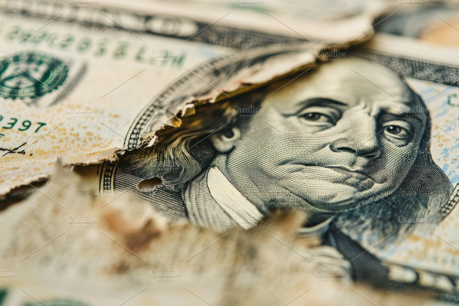 Closeup detail of a torn dollar, a Photo by Pavel_design