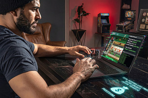 Man hacking casino slot on laptop at home, a Sports & Recreation Photo by Davizro's Market
