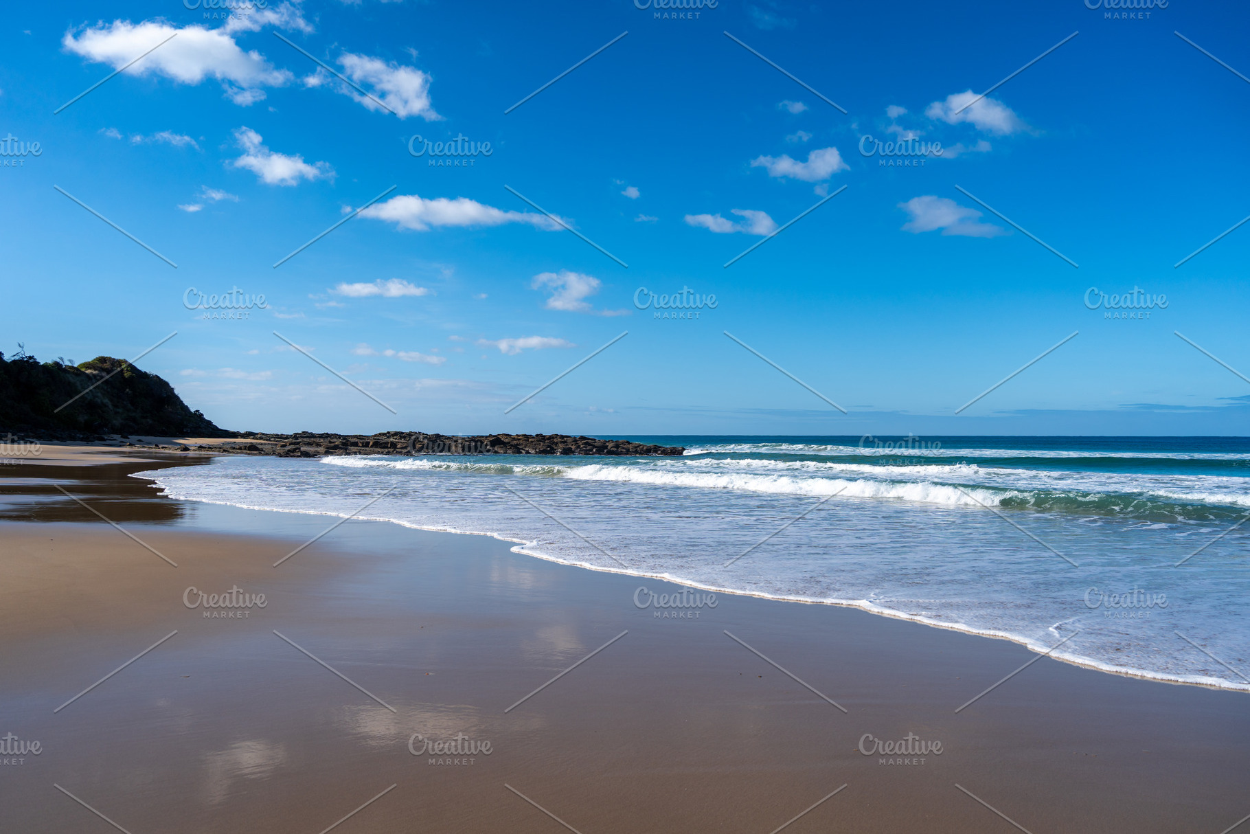 Sandy shore and ocean waves at Apollo Bay Beach, Australia, a Nature Photo by GoodGoods