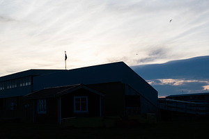 Silhouetted buildings and sky during sunset in Akranes, Iceland, a Photo by AS photostudio