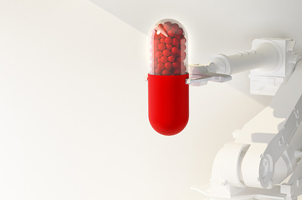 robotic arm holding a pill