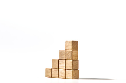 Wood cubes stacked as stair step shapes on white, a Business Photo by 1981 Rustic studio kan
