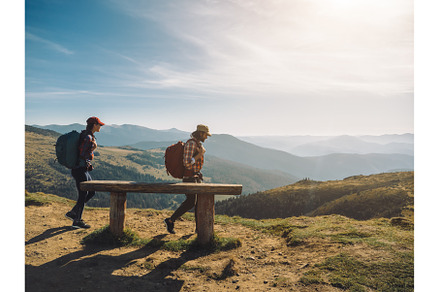Couple of Hikers With Backpacks in
