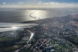 Aerial view of Lisbon, Portugal with river and bridge under bright sunny sky, a Photo by AS photostudio