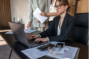 Young businesswoman wearing glasses, a Business Photo by undrey