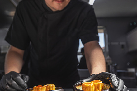 Professional chef plating elegant appetizers, a Photo by Grafvision photography