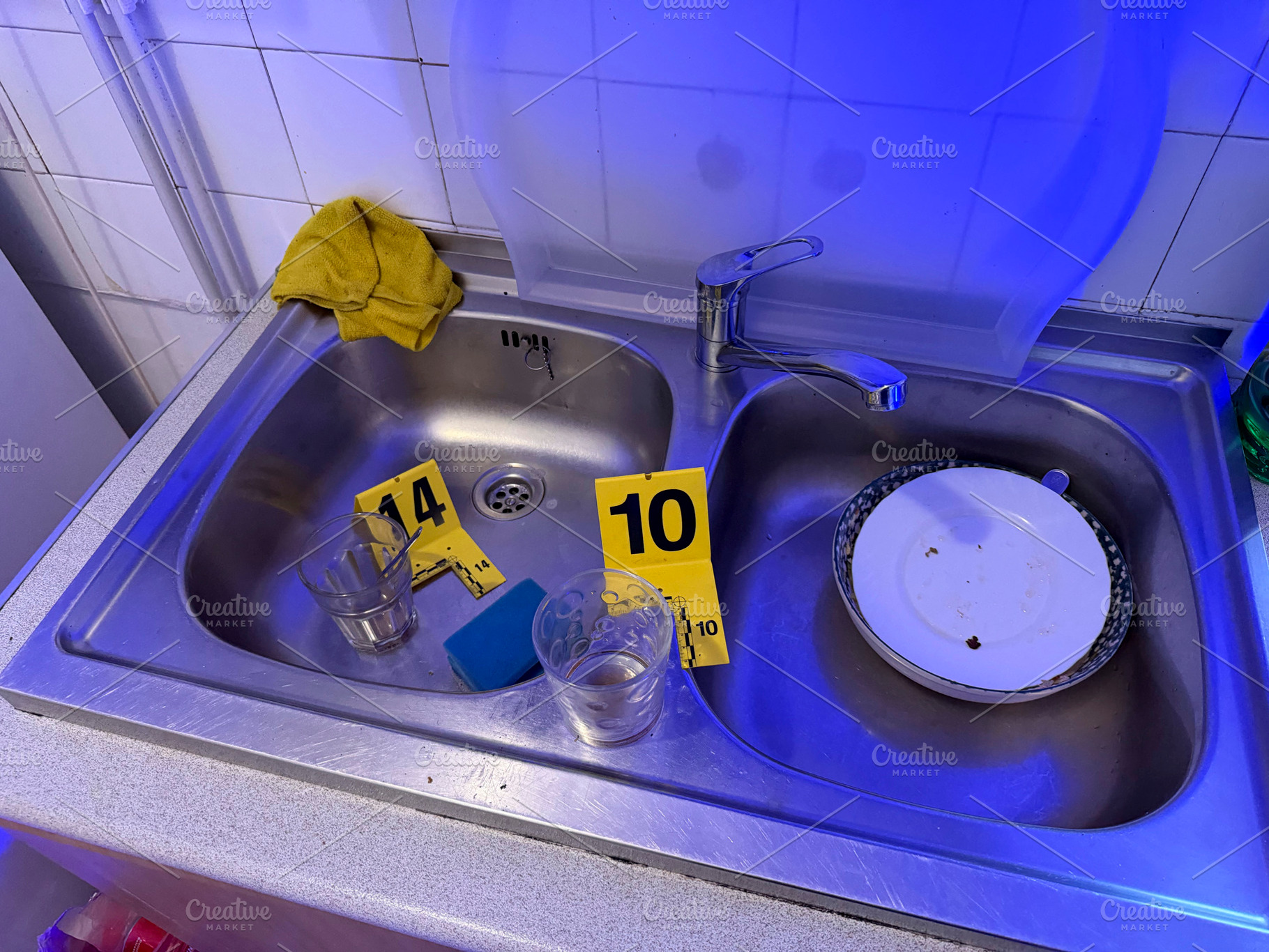 Crime scene in kitchen with evidence markers, an Industrial Photo by karrastock