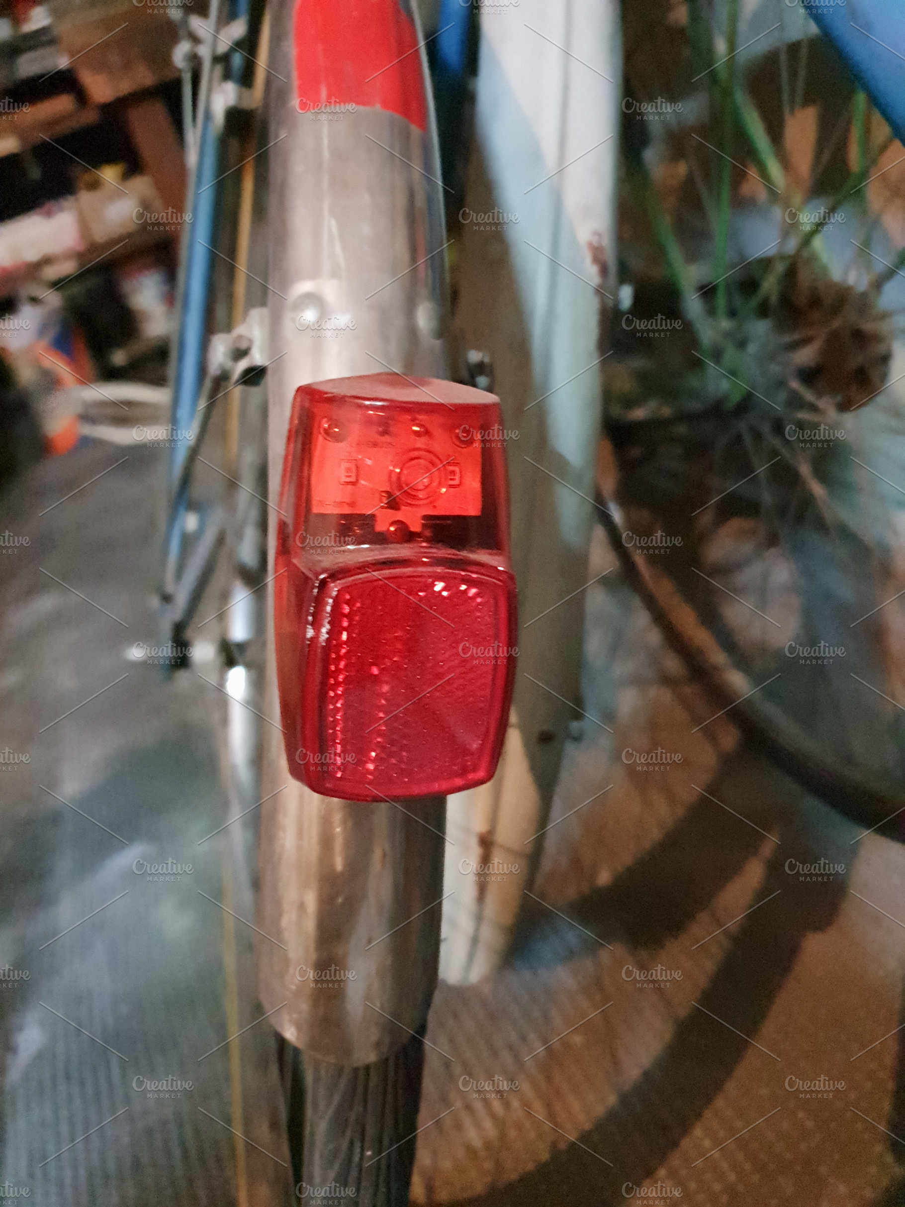 bike parked in garage, focus on light, a Photo by WorldOfPhotos