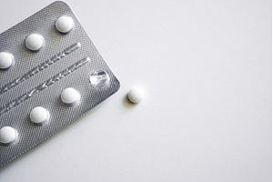 Single tablet near silver blister, a Health & Medical Photo by volodymyrshtun13795