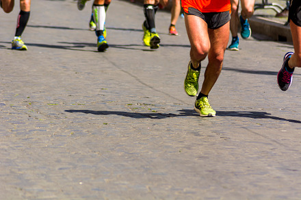 Runners during a city marathon containing jogging, running, and sport, a Sports & Recreation Photo by rarrarorro