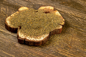 dried tea leaves, ground and crumbled into very small pieces with the addition, a Photo by rsoollAI