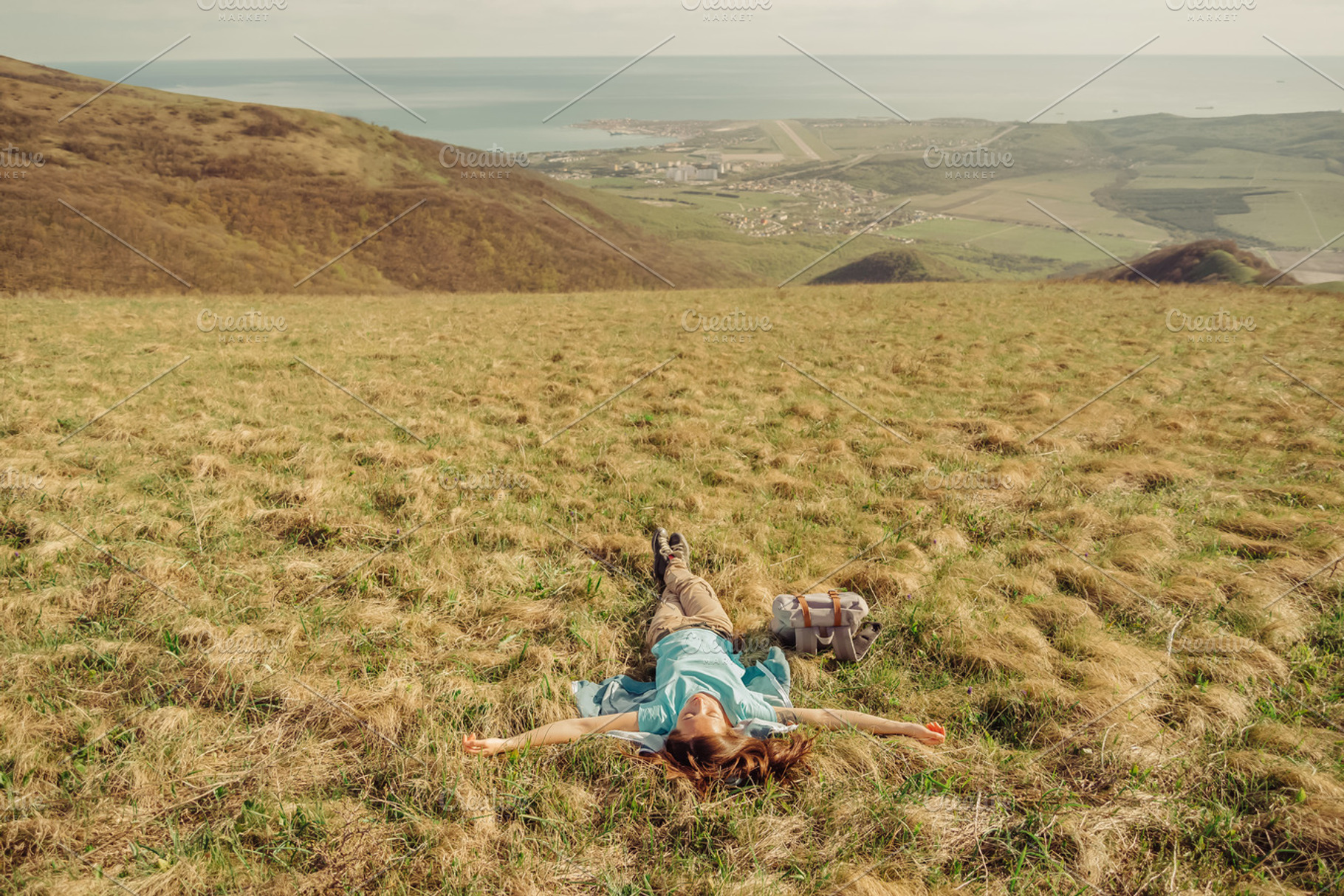 Happy hiker woman lying, a Person Photo by P&G