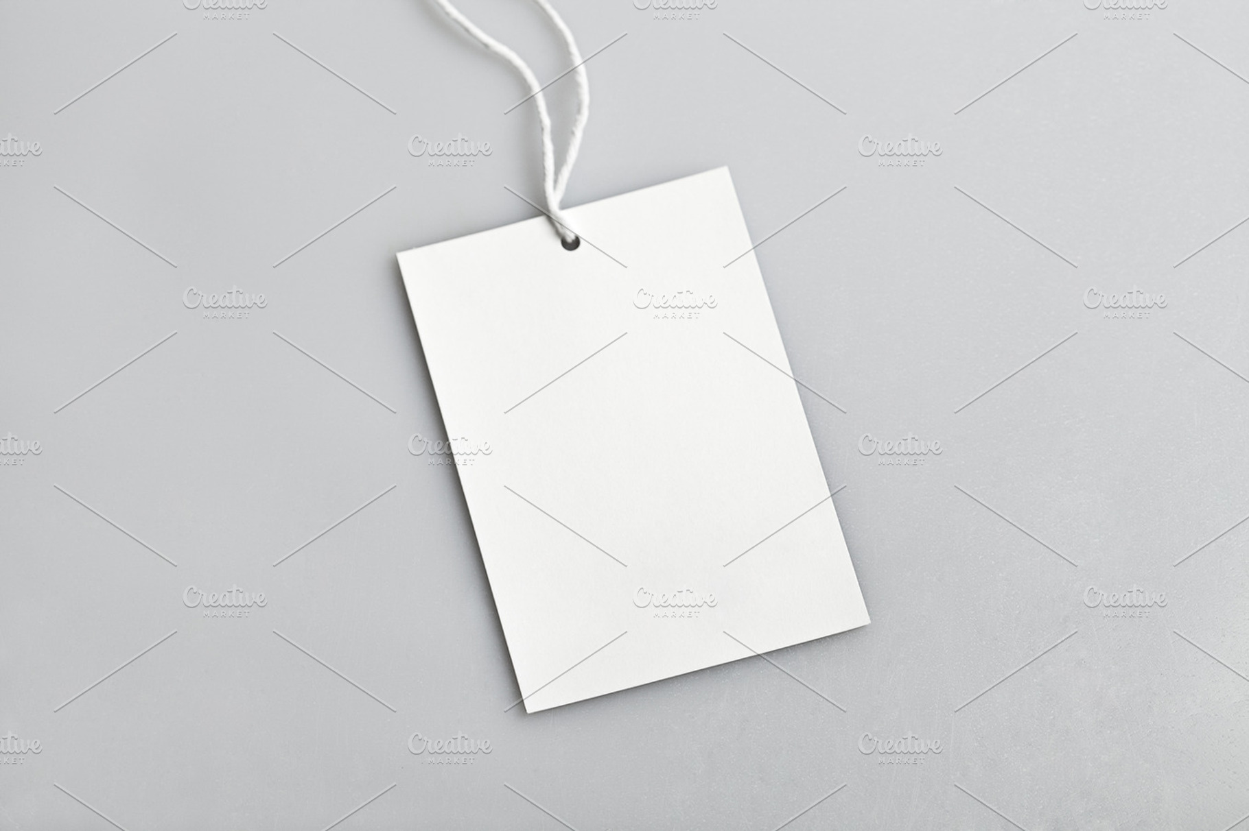 Cloth label blank white tag containing background, blank, and closeup, a Business Photo by Olha Klein
