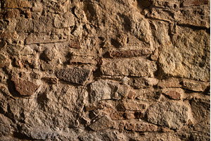 Rough ancient stone and rock wall, a Background Photo by volodymyrshtun13795
