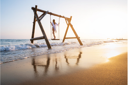 Happy young woman on wooden swing in, a Person Photo by den-belitsky