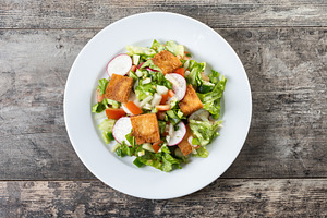 Fattoush salad, Traditional Lebanese Salad on wooden table, a Food & Drink Photo by etorres69
