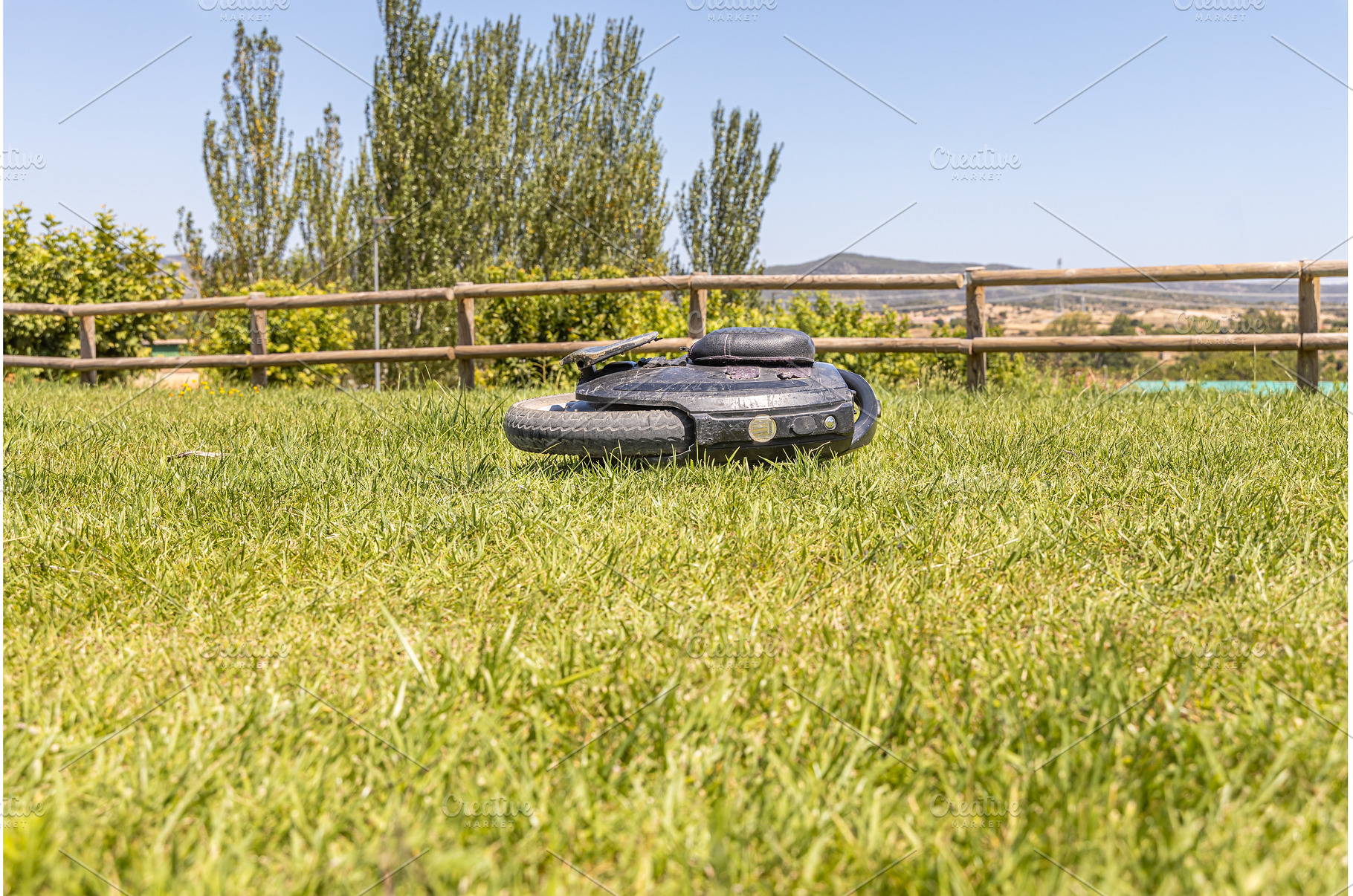 Electric unicycle lies on the green, a Sports & Recreation Photo by Illustrations&photos